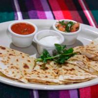 Quesadilla Santa Fe Appetizer · 2 flour tortillas grilled, filled with melted cheese and your choice of grilled chicken or s...