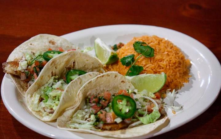 Tacos de Pescado · 3 flour tortillas with grilled tilapia with pico de gallo and lettuce. Served with rice on the side.