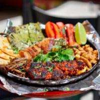 David’s Skillet Fajita · Grilled steak, chicken, chorizo, bacon-wrapped jalapeno, napal, Mexican Frank sausage and a ...