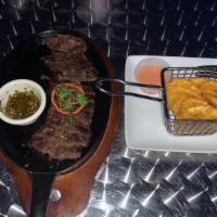 Churrasco Plate · Paired with the choice of 1 side: fried plantains, fries or rice and beans.