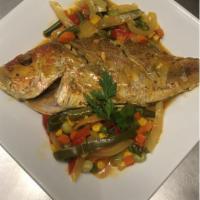Steamed Fish  · Paired with the choice of 1 side: fried plantains, fries or rice and beans.