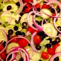 House Salad · Tossed garden salad topped with cucumbers, tomatoes, red onions and olives.