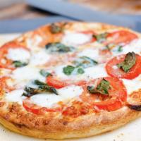 Tony's Margherita · Our traditional pizza (sauce and blended cheeses) topped with fresh sliced tomatoes, mozzare...