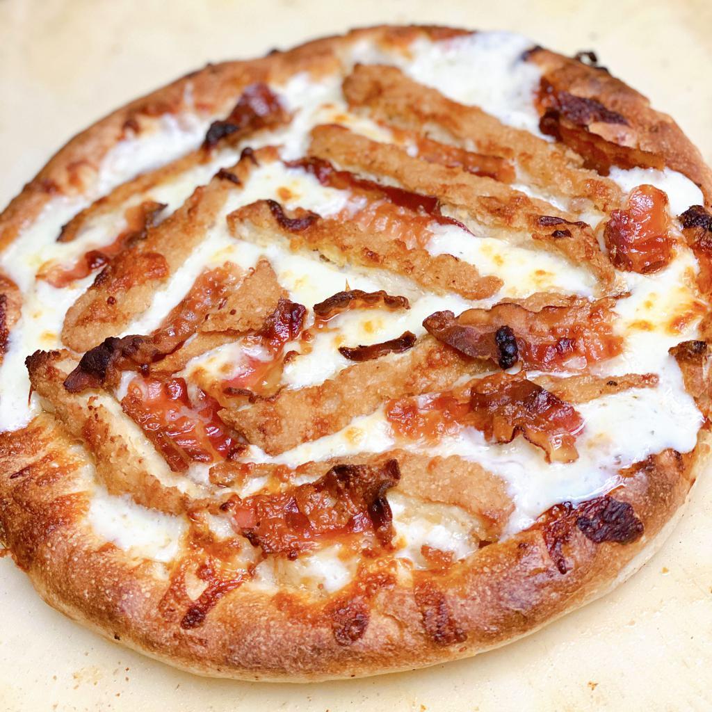 Chicken Bacon Ranch Pizza  · Homemade white pizza dough topped with ranch dressing, shredded cheese, crispy chicken and bacon 
