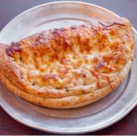 Tony's Calzone · Made with our homemade dough, folded over and stuffed with fresh ingredients (pizza cheese, ...