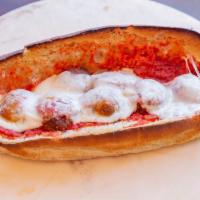 Meatball Parmesan Grinder · Soft sub roll with sauce and provolone or American cheese.