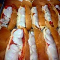 Chicken Parmesan Grinder · Soft sub roll with a fried chicken patty served with sauce and provolone or American cheese.