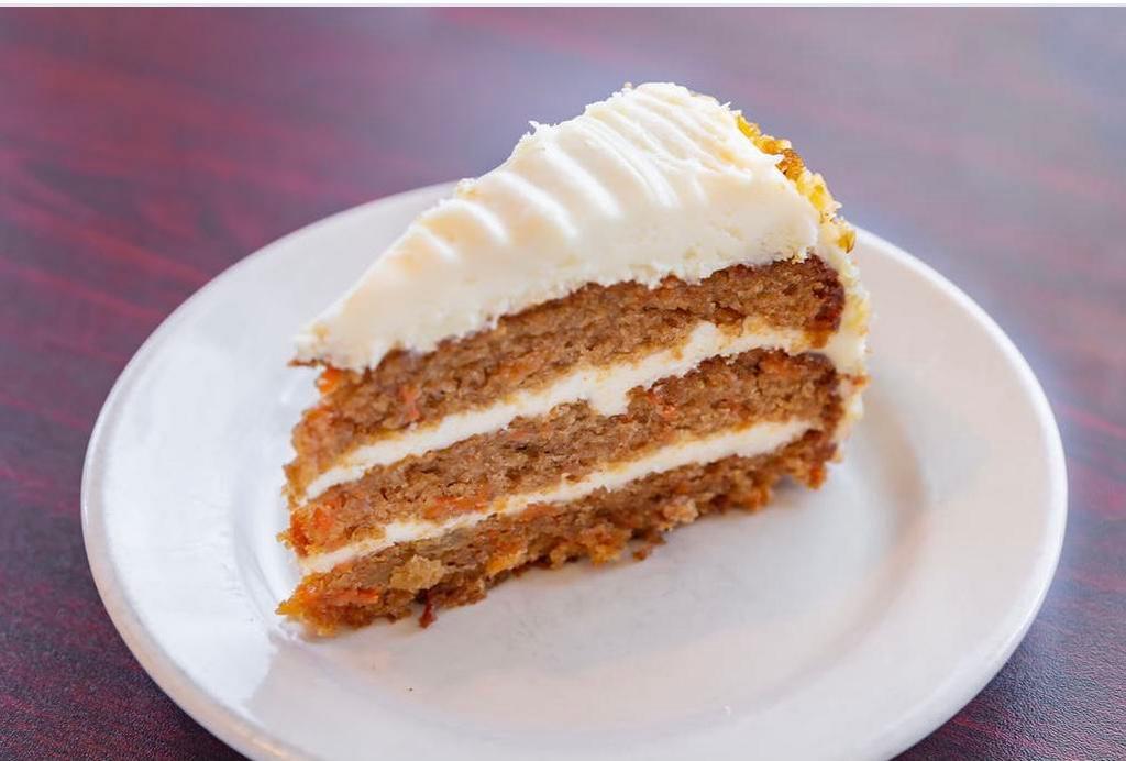 Carrot Cake · Triple layers of cake and cream cheese frosting. Pre-cut slices. 