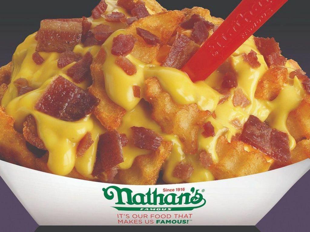 Bacon Cheese Fries · Crinkle cut fries topped with cheddar cheese sauce and bacon.