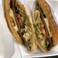 Milanesa Torta · With mayonnaise, cheese, lettuce, tomato, beans, and avocado.