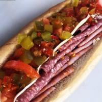 Italian Sub · with your choice of: lettuce, tomatoes, pickles, onions, hots, oil, Mayo.