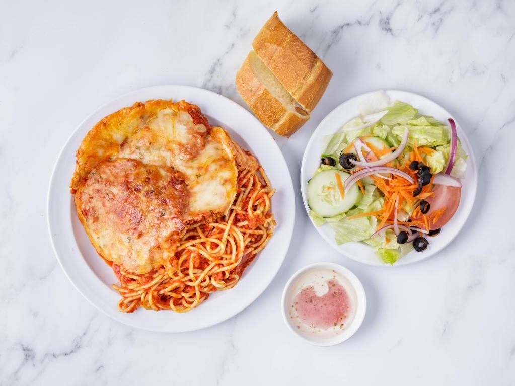 Chicken Cutlet Parmigiana · Served with salad, bread and choice of pasta.