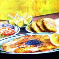 Tilapia Caribe · Grilled and served with 2 side dishes.