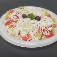 Greek Salad · Tomato, cucumber, red onion, red pepper, olives, feta cheese, and parsley.