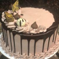 Chocolate Mousse Torte · Rich chocolate cake coated with chocolate ganache, chocolate mousse filling, topped with cho...
