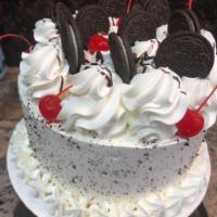 Cookies and Cream Torte · Moist chocolate layers, filled with cookies and French cream. Whipped cream fronting, topped...