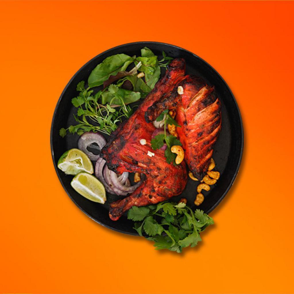Tandoori Chicken Feast · Bone-in chicken marinated in yogurt and house spices cooked to perfection in an indian clay oven.