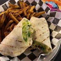 Grilled Chicken Caesar Wrap · Fresh romaine lettuce, grilled chicken breast, housemade croutons and Caesar dressing rolled...