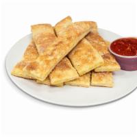 Garlic Parmesan Breadsticks · Brushed with butter and garlic, topped with Parmesan cheese. Served with pizza sauce.