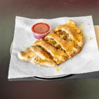 Large Supreme Calzone · Signature dressing, pepperoni, ham, sausage, mushrooms, onions, green peppers, black olives ...