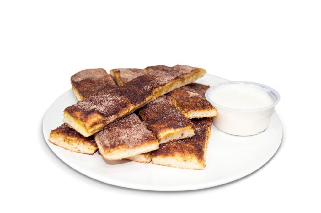 Cinnamon Bread Sticks · brushed with butter and topped with cinnamon-sugar mix. Served with  icing