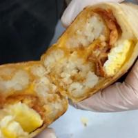 Breakfast Burrito · Hash Browns, egg, & shredded cheese with your choice of meat