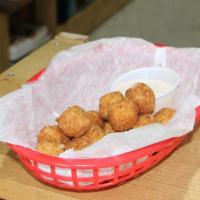 Golden Cheese Snitches · Fried cheese balls that melt in your mouth and not in your hands; served with a house made r...