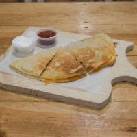 Quesadilla of Benjamin Button · Flour tortilla with cheddar cheese, jalapenos and black beans. Your choice of bacon, ground ...