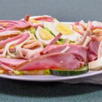 Chef Salad · Romaine lettuce, Roma tomatoes, cucumber, turkey, turkey ham, American cheese, provolone and...