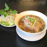 18. Large Pho Express Special · Rare steak, well done steak, brisket, tendon and tripe with rice noodle soup.
