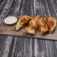 Buffalo Chicken Calzone · Fried buffalo chicken. Mozzarella and cheddar cheese wrapped in freshly made dough, served w...