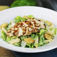 Chicken Caesar Salad · Romaine, lettuce, croutons, parmesan cheese, bacon, tomatoes and hard-boiled egg.
