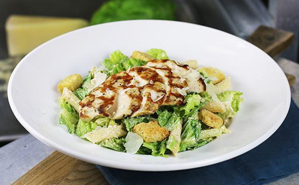 Chicken Caesar Salad · Romaine, lettuce, croutons, parmesan cheese, bacon, tomatoes and hard-boiled egg.