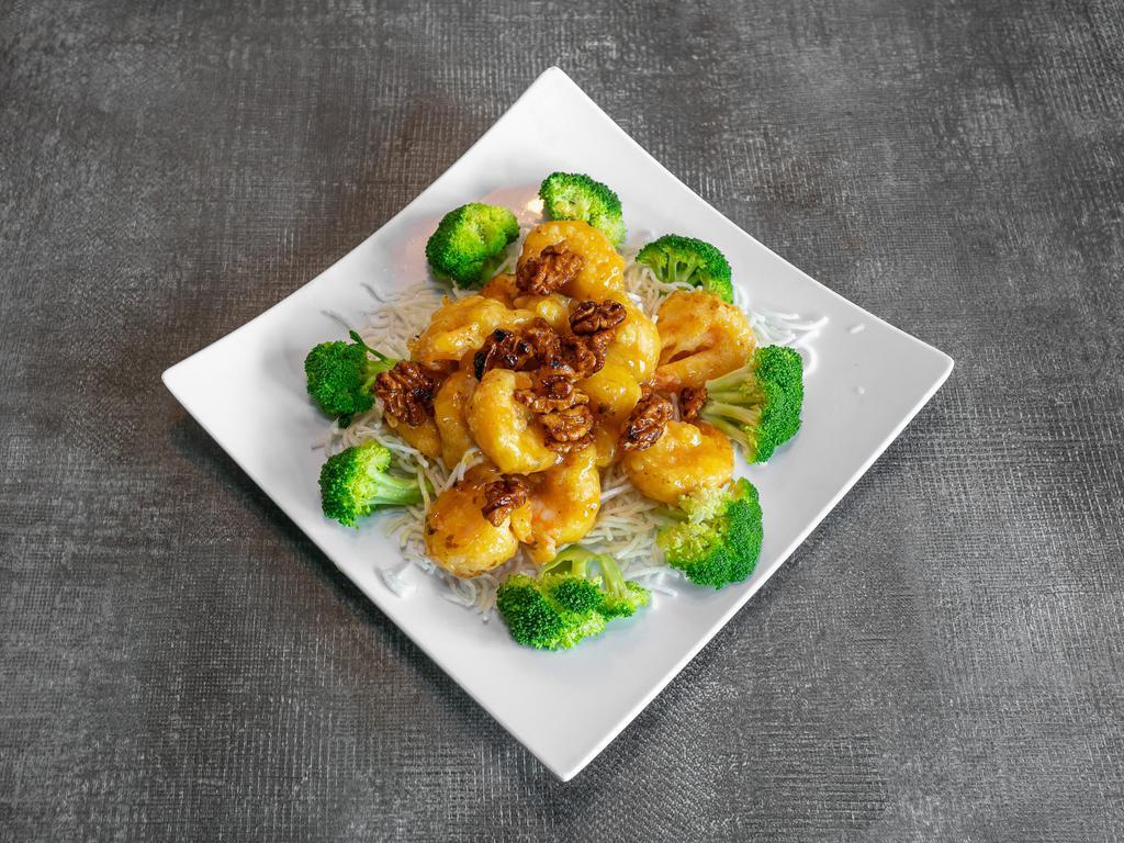 CS10. Honey Walnut Shrimp · Lightly battered fried prawns in a honey glaze, gamished with broccoli and topped with walnuts.