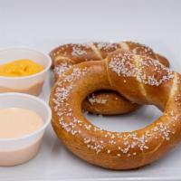 Bavarian Pretzels · Bavarian top knot pretzels with pimento nacho cheese and Sriracha ranch sauces.