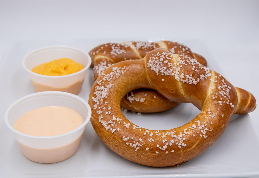 Bavarian Pretzels · Bavarian top knot pretzels with pimento nacho cheese and Sriracha ranch sauces.