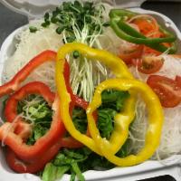 Pietro Rainbow Salad · Layered with raw potato, green leaf lettuce, carrots and daikon with bell peppers rings on t...