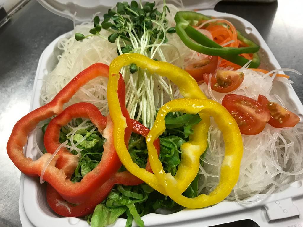 Pietro Rainbow Salad · Layered with raw potato, green leaf lettuce, carrots and daikon with bell peppers rings on the side.