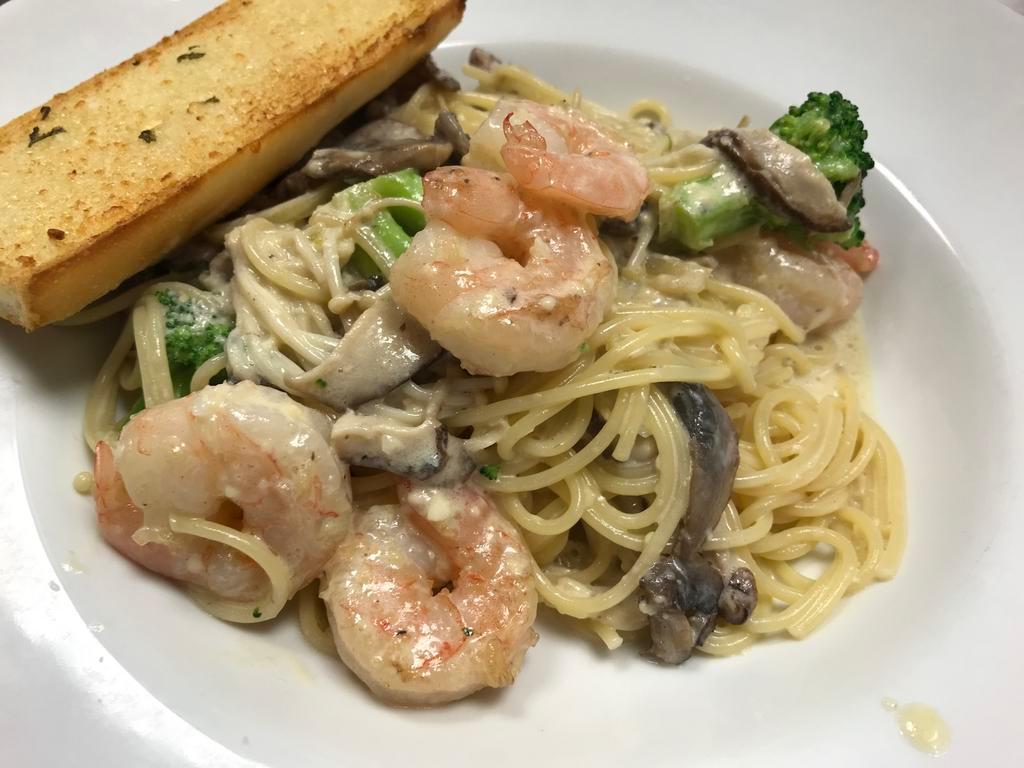 Shrimp and Shiitake Mushroom · Shrimp, shiitake, enoki, button mushrooms, onions and broccoli in our carbonara sauce with spaghetti pasta. Served with garlic bread.
