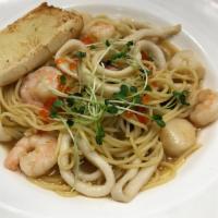 Seafood Pietro Style · Shrimp, scallop, tako, squid and ikura in a light shoyu butter sauce with spaghetti pasta. S...
