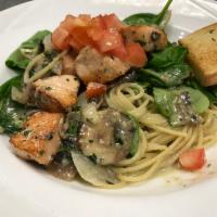 Salmon and Fresh Spinach Basil Cream · Salmon, fresh spinach, mushrooms, onions topped with tomato in a basil cream sauce with spag...