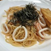 Tarako and Ika · Salted cod fish eggs with ika in a japanese sauce with spaghetti pasta. Served with garlic b...