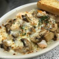 Shrimp Mushroom Doria · Sauteed shrimp & mushrooms in a cream sauce over seasoned rice topped with mozzarella cheese...