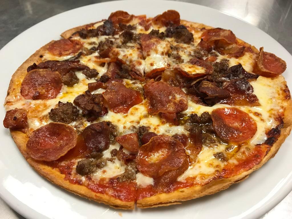 10” Meat Lover's Pizza · Pepperoni, bacon, spicy ground beef, sausage, cheese with tomato sauce on our thin crust, made to order.