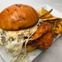 FRIED CHICKEN SANDWICH · pickle brined breast topped with jalapeno slaw, bread and butter pickles and tabasco aioli