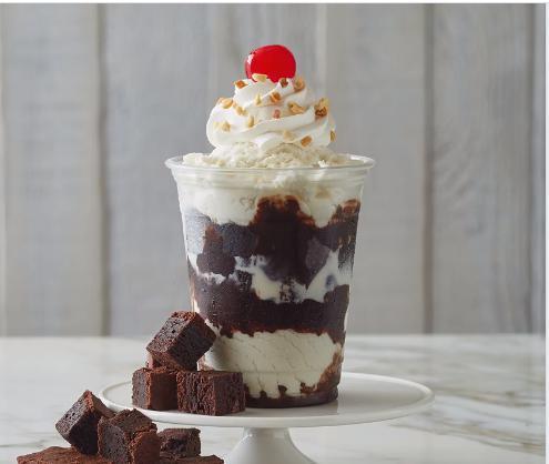 Fudge Brownie Delight · Warm up with 2 hot fudge brownies topped with your choice of ice cream, a mix-in, hot fudge and whipped cream.