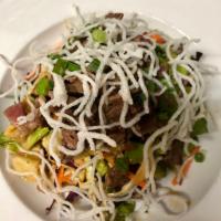 Asian Beef Short Rib Salad · Romaine, cabbage, carrots, cucumber, green onion, edamame crispy noodles and soy ginger vina...