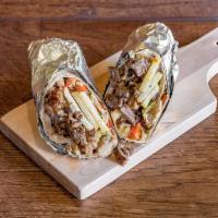Super Grilled Beef Burrito · Beef, rice, beans, pico and cheese, guacamole and sour cream.