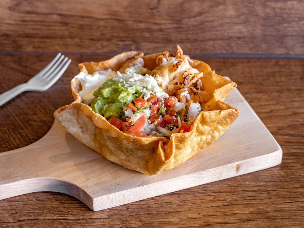 Grilled Beef Taco Salad  · Beef, beans, lettuce, pico, cheese, guacamole and sour cream.