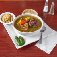 Res Sopa / Beef Stew · Caldo de res con yucca, maiz, zanahoria, wiskil, calabasa y repollo. Servido con arroz y 2 t...